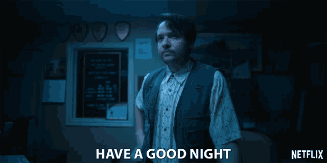 a man standing in a dark room with the words have a good night