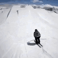a person is skiing down a snow covered slope on skis