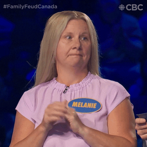 a woman in a purple shirt has a name tag that says melanie