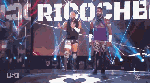 two wrestlers are standing in front of a screen that says ' rioche ' on it