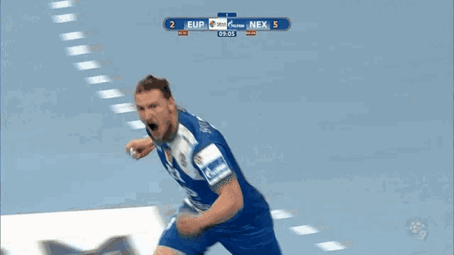 a man in a blue and white jersey celebrates a goal
