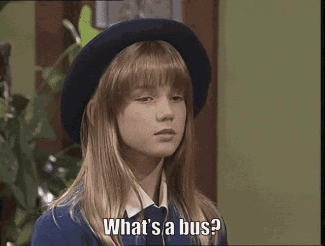 a girl wearing a blue hat says what 's a bus