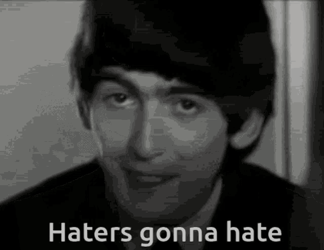 a black and white photo of a man 's face with the words `` haters gonna hate '' written on it .