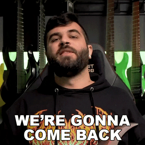 a man with a beard says " we 're gonna come back " while sitting in a chair