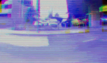 a blurry picture of a person riding a bike