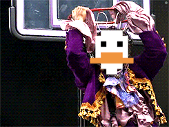 a person in a purple dress is holding a basketball hoop in front of a basketball hoop