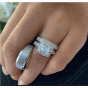 a woman is wearing a wedding ring and a ring on her left hand