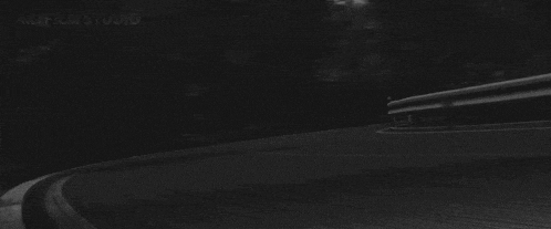 a black and white photo of a car with the license plate number 954j