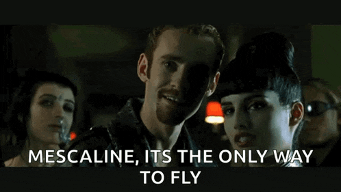 a man and a woman are standing next to each other with the words mescaline its the only way