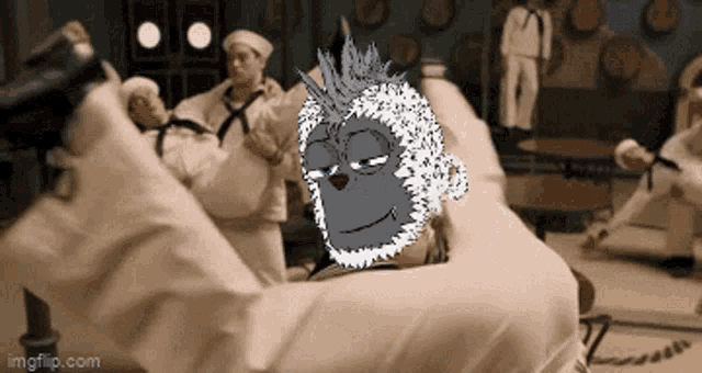 a monkey is laying on a bed with a group of sailors in the background