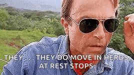 a man wearing sunglasses and a denim shirt says `` they do move in herds at rest stops ''