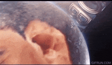 a close up of a pregnant woman 's belly with the words gifrun.com at the bottom