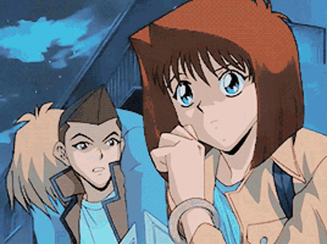 a man and a woman are standing next to each other