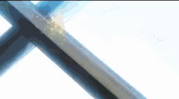 a close up of a person welding a piece of metal with a lot of sparks coming out of it .