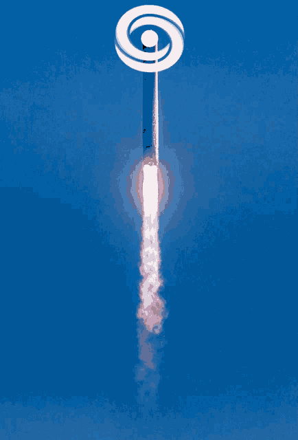 a rocket is flying through a blue sky with the letter g on top