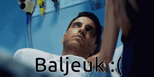 a man laying in a hospital bed with the word baljeuk written on the bottom