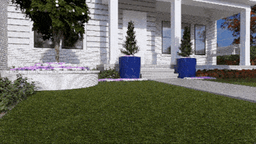 a white brick house with a blue planter in front of it