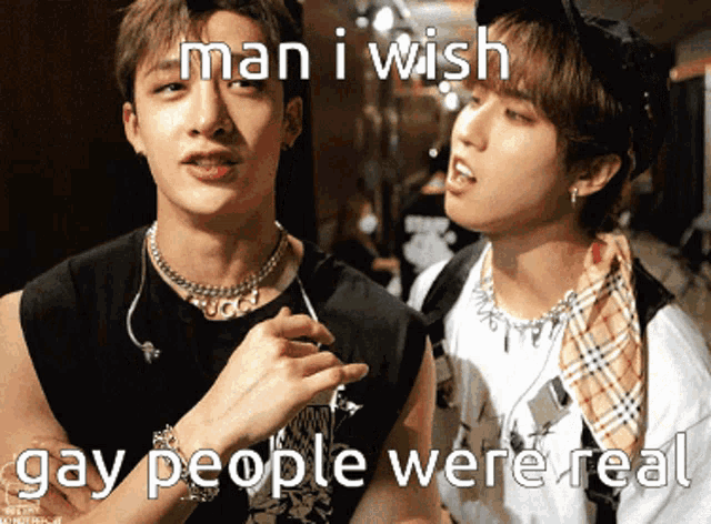 two young men are standing next to each other and one of them is wearing a necklace that says gucci