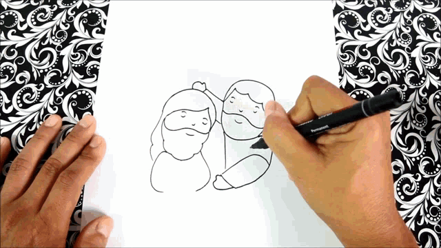 a person is drawing two people with a pen that says panasonic