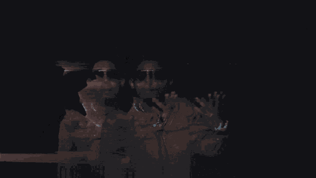 a man wearing sunglasses and a watch holds his hands up in the air