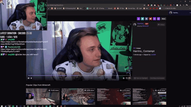 a man wearing headphones is playing a video game on a computer