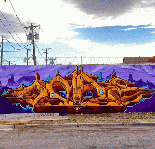 a large graffiti mural on a purple wall that says ' squid '