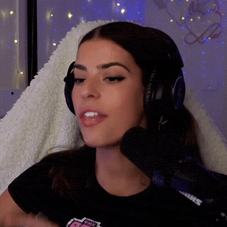 a woman wearing headphones and a shirt that says powerpuff girls on it