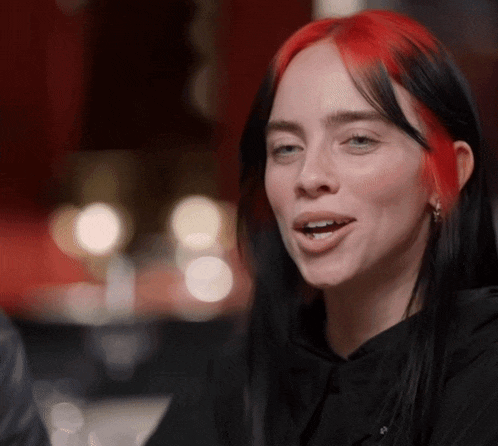 a close up of a woman with red hair
