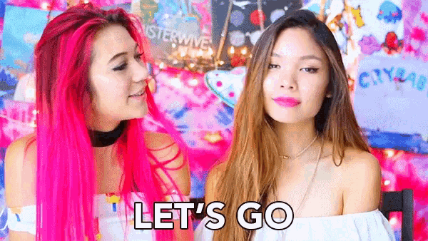 a girl with pink hair says let 's go next to a girl with brown hair
