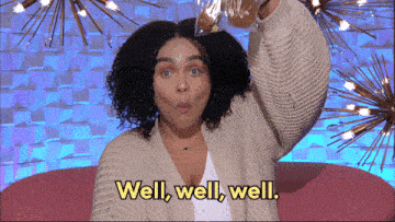 a woman is holding a bag of food in her hand and says well well well .