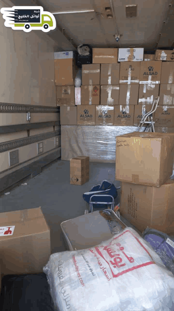 a stack of boxes with one that says alsad