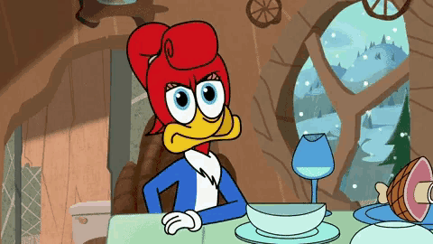 woody woodpecker is sitting at a table with a bowl of soup and a glass of wine