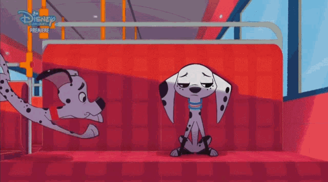 two dalmatian dogs sitting next to each other on a red couch with a disney channel premiere logo in the background