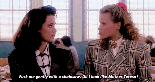 two women are sitting next to each other in a classroom and one of them is saying `` fuck me gently with a chainsaw .