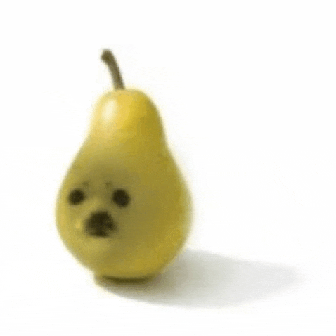 a pear with a dog face on it .