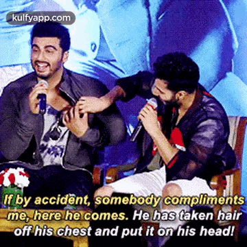 two men are sitting next to each other and one has taken his hair off his chest