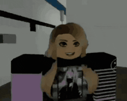 a girl is wearing a black shirt with a picture of a castle on it and smiling .