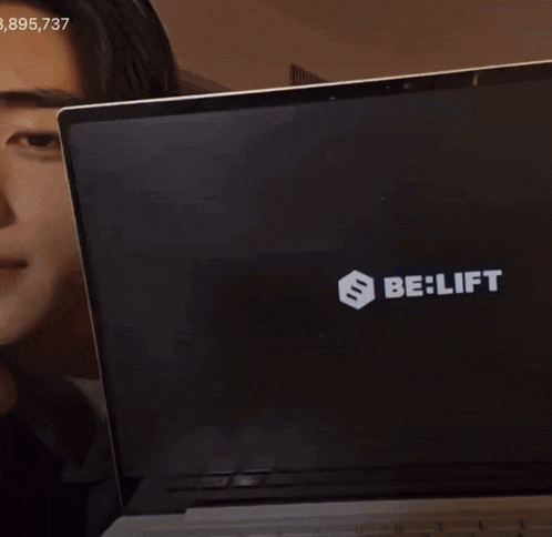 a close up of a person looking at a tablet with the number 8,895,737 on the bottom