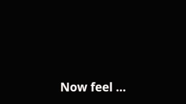 an elderly woman says " now feel " in front of her