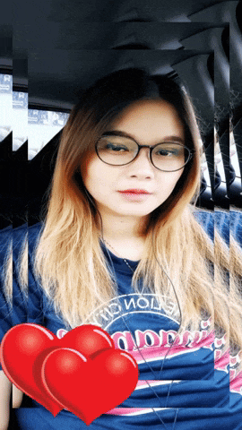 a woman wearing glasses and a shirt that says ' champions '