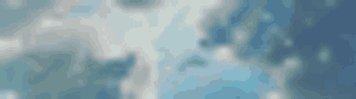 a blurred image of a blue sky with clouds