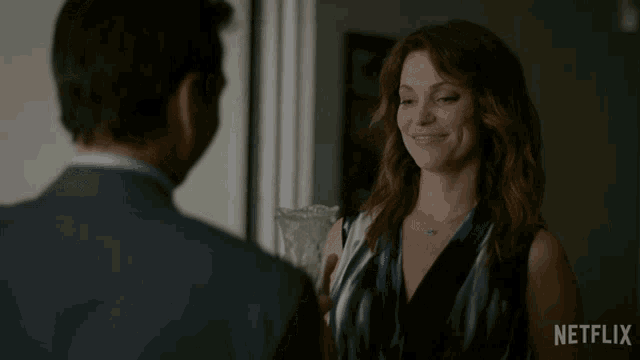 a netflix ad shows a woman holding a glass and a man holding a glass
