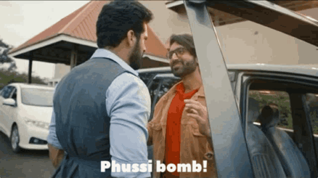 two men standing next to each other with the words phussi bomb written on the bottom