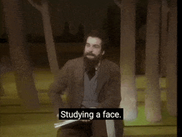 a man with a beard is holding a piece of paper and says " leaves a little space in the way like a window