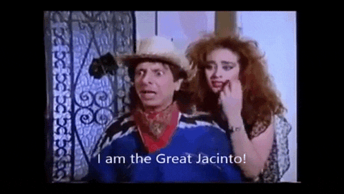 a man and a woman are standing next to each other and the woman is saying `` i am the great jacinto ! ''