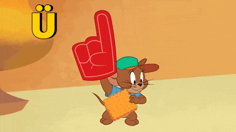 jerry from tom and jerry is holding a foam finger and a cookie .