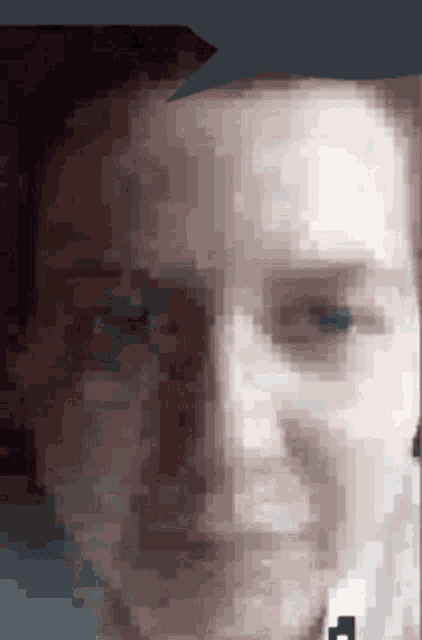 a pixelated image of a man 's face with a black arrow pointing to his left