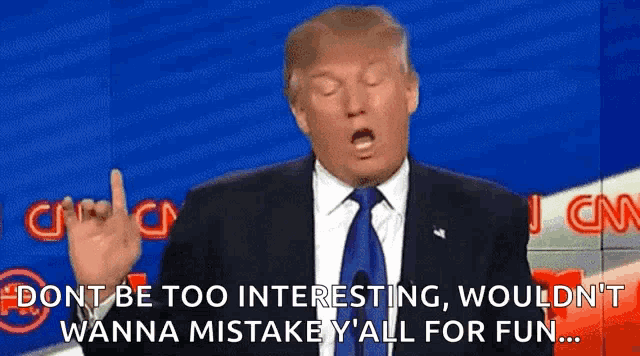 donald trump is giving a speech on cnn and making a horn sign with his hand