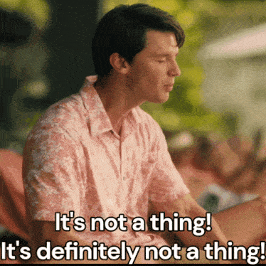 a man wearing a pink shirt says it 's not a thing it 's definitely not a thing