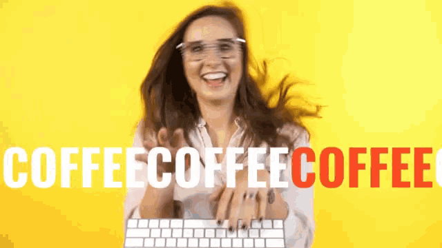 a woman is holding a keyboard in front of the words coffeecoffeecoffee
